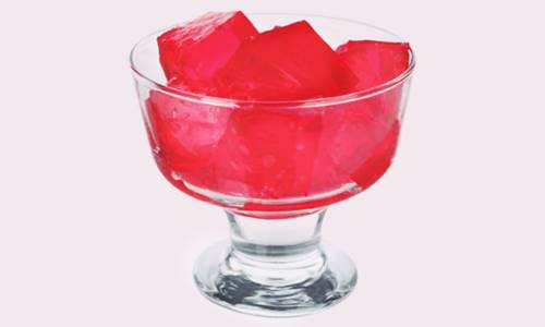 red gelatin in cubes, in a glass