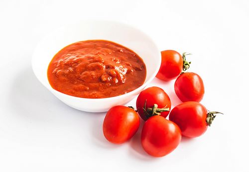 dish with tomato sauce and some cherry tomatoes