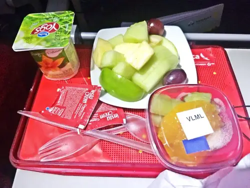 inflight vegetarian meal fruit, yogurt