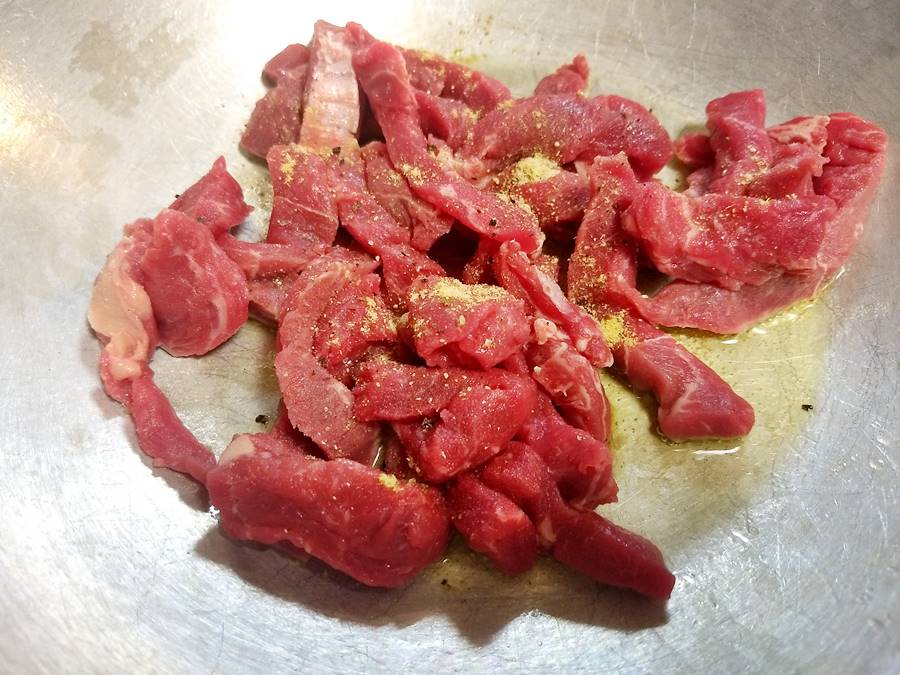 beef strips sealing in hot wok