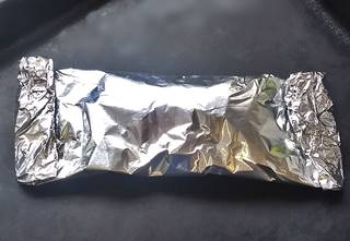 ready to bake salmon wrapped in aluminium foil ready for the oven