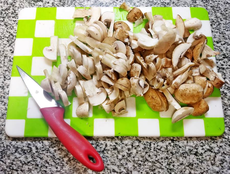 Sliced mushrooms on cutting board