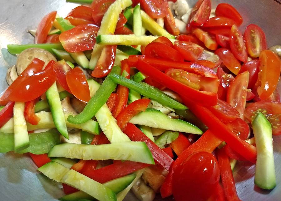 peppers, squash inside wok