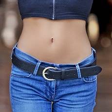 young woman's bare tummy and slim waist