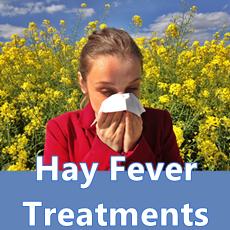 woman sneezing in field with flowers