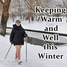 woman walking in the snow, warm and happy